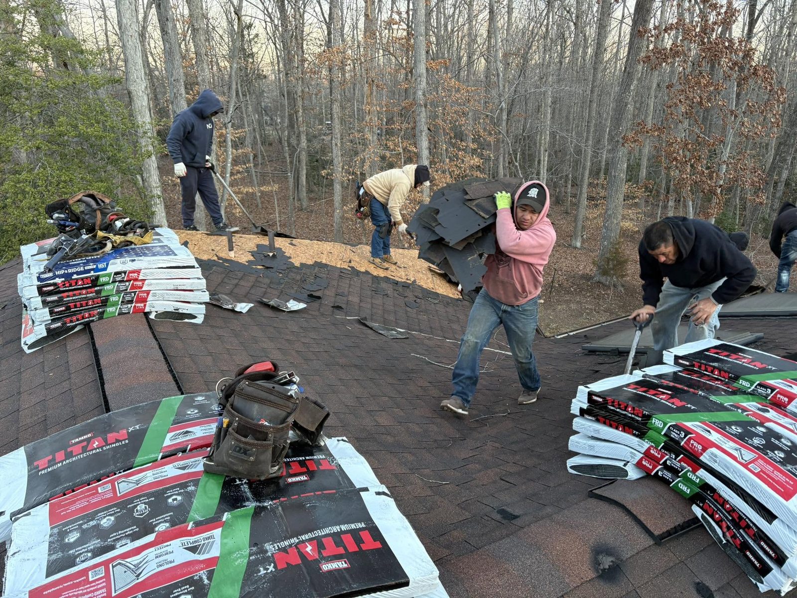 Roofing crew installing Titan XT shingles on a Mineral roof